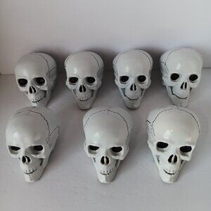 (7) Miniature Plastic Skeleton Skulls With Hinged Jaws